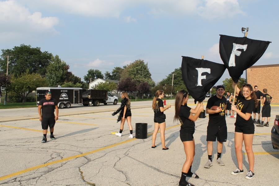 Army of Darkness tailgate attendees get ready for the first game, which was played at Lake Zurich High School.