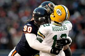Defensive lineman Jeremiah Ratliff  gets pressure on Packers quarterback Aaron Rodgers.